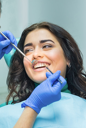 Young woman receiving dental services in Oxnard