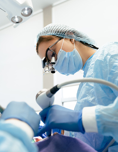 Oral surgeon working on patient's teeth at Oxnard Dental Office